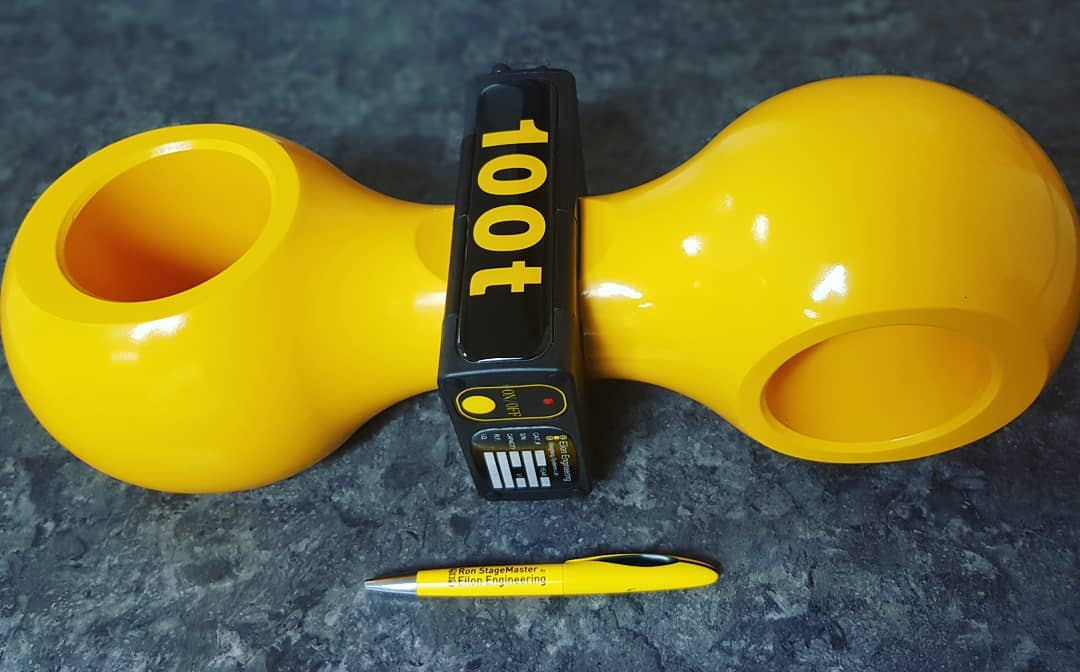 100-ton load cell next to a pen for scale