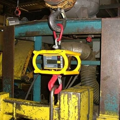 Ron 3025 crane scale with optional cage in use at a factory