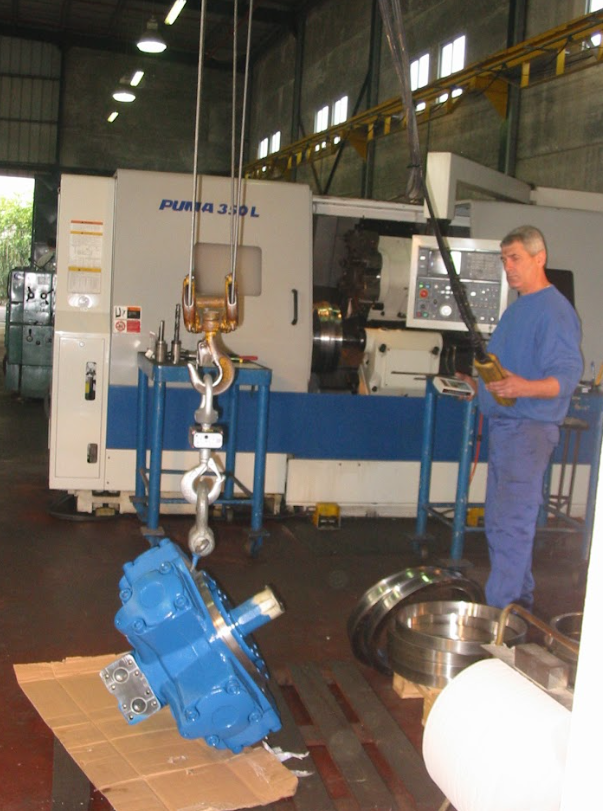 Person working with machinery in a factory setting